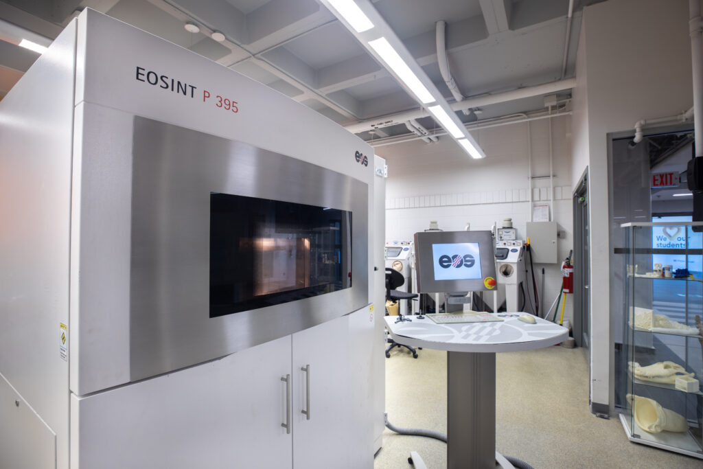 3D printer beside table in the AMIC lab