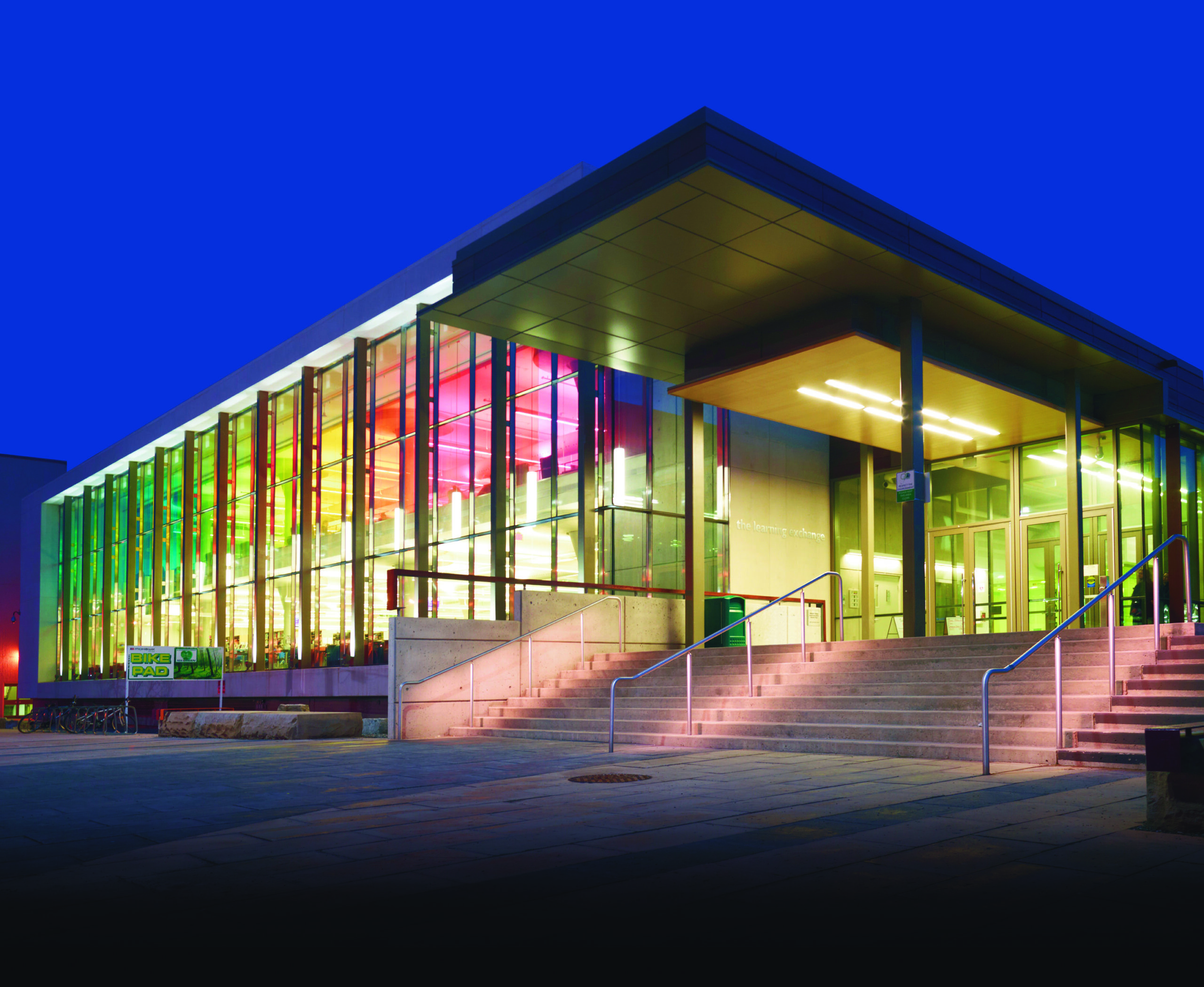 The Mohawk College Fennel Library with lights at night.