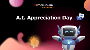 Illustration of a smiling cartoon robot with glowing blue eyes, standing on a gradient background of black, pink, and deep red. Text in bold white reads “A.I. Appreciation Day” beneath the Mohawk IDEAWORKS logo. Speech bubble and lightbulb icons float nearby, symbolizing ideas and communication.