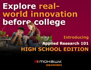 Promotional graphic reading “Explore real-world innovation before college” and “Introducing Applied Research 101 – High School Edition.” Two high school students work together in a classroom lab, examining test tubes and plants during a hands-on science activity. The background features a maroon, technology-inspired pattern, and the Mohawk IDEAWORKS logo appears at the bottom.